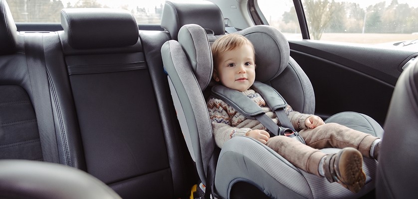 Child seating in child seat of a vehicle